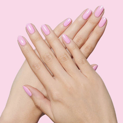 Hands with nails polished in JM pinky lavender gel polish for a smooth and pretty mani by Olive and June