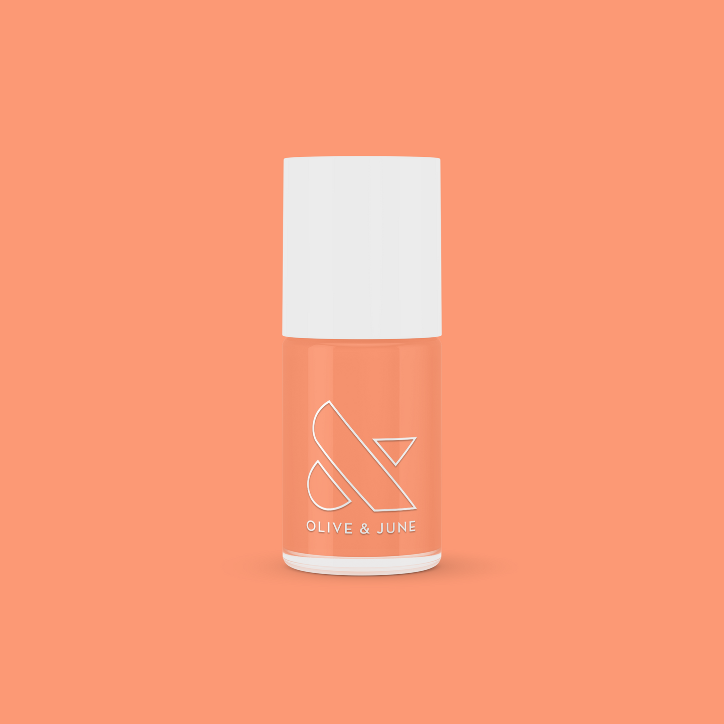 Olive and June Wild & Free gel polish bottle in fierce coral shade on a bright coral background for at-home mani.