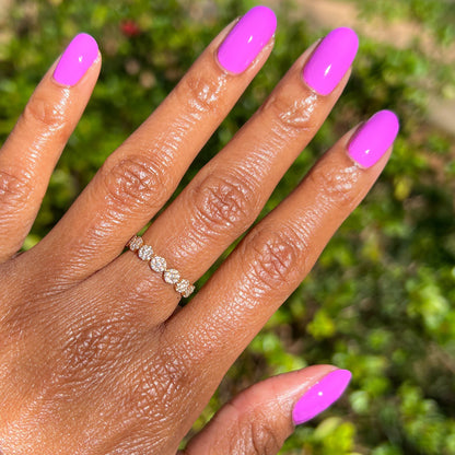 Hand with nails painted in vibrant magenta shade using Jam, Please polish for a bright, long-lasting manicure by Olive and June