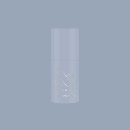 Vintage - Gel polish bottle in vintage denim blue shade on matching blue background by Olive and June