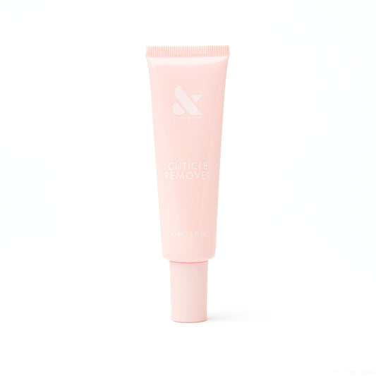 Soft pink tube of Cuticle Remover designed for gentle exfoliation and easy manicure care shown on white background