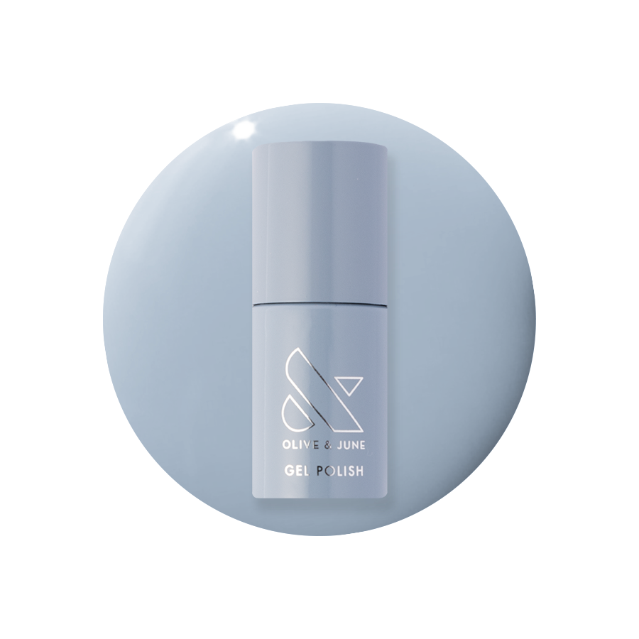Vintage - Gel polish bottle in a classic denim blue shade on a matching blue gel polish background by Olive and June