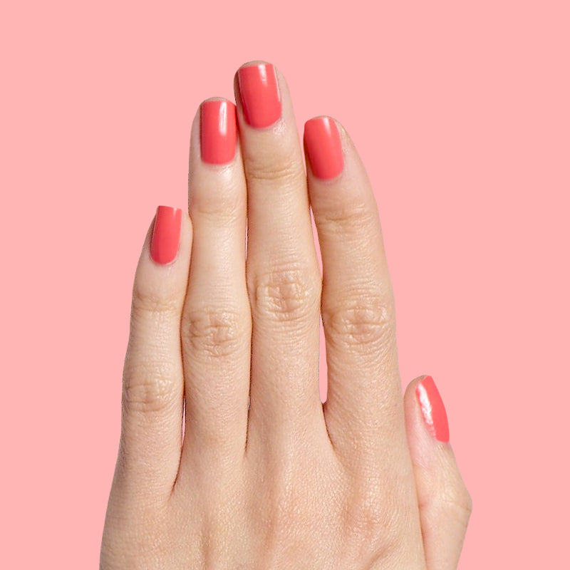Perfect Pinwheel coral gel polish on natural nails with a smooth glossy finish for a cheerful manicure at home
