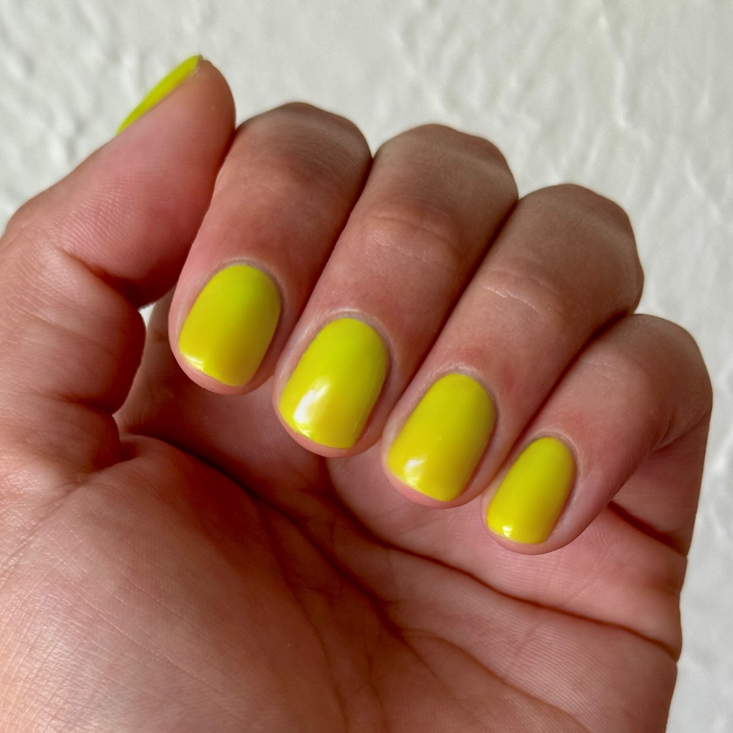 Time To Re-apply - Gel bright yellow green gel polish on natural nails with smooth glossy finish for a fresh manicure