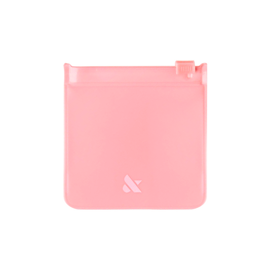 Mini Pouch in soft pink with zip-top closure, perfect for storing press-on nails and manicure essentials.
